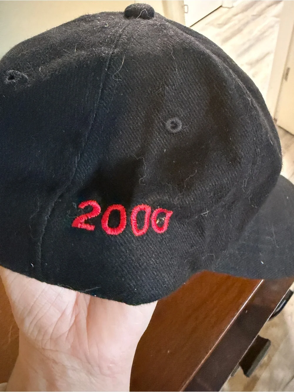Truck Tour Black Baseball Cap with Red Logo